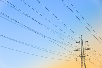 Electric power lines at sunset