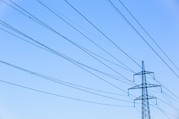 Electric power lines against blue sky © zlikovec