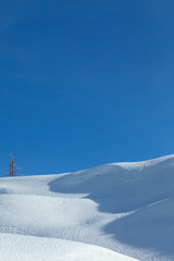 Winter landscape with snow and blue sky