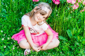 Summer portrait of a cute little girl © annanahabed