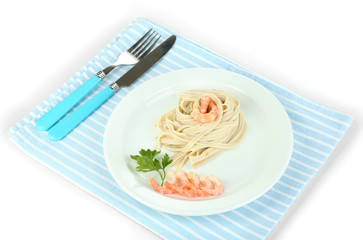 Pasta with shrimps on white plate, isolated on white