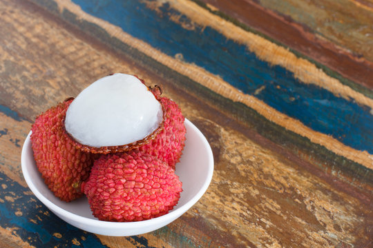 Lychee on white plate on table