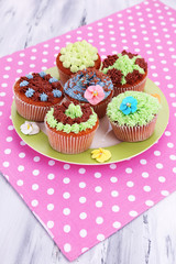 Tasty cupcakes with butter cream,