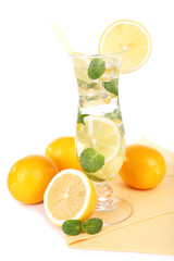 Glass of cocktail with lemon and mint isolated on white