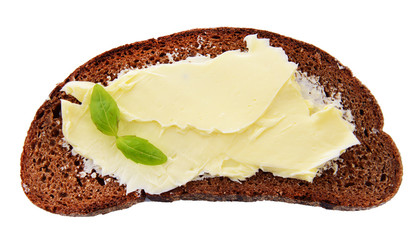 Slice of rye bread with butter, isolated on white