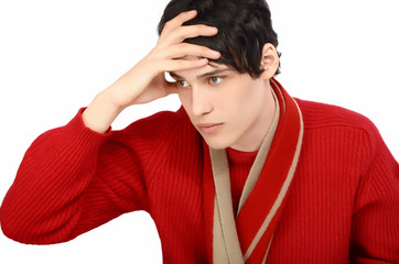 Profile of a young man dressed for a cold winter,looking worried