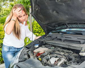 Young Woman with Damaged Car