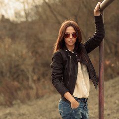 Fashionable woman posing outdoors - portrait