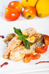 salmon belly garnish with pesto potatoes and friend tomatoes