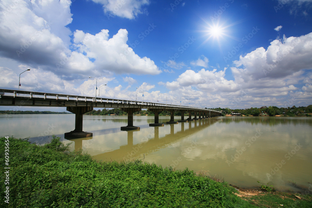 Wall mural bridge against blue sky and sunbeam