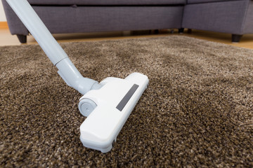 Cleaning carpet with vacuum