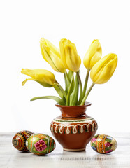 Beautiful yellow tulips in white wicker basket easter