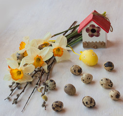 Easter still life with daffodils and willow twigs