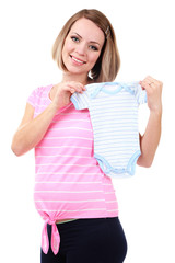 Young pregnant woman holding blue romper isolated on white