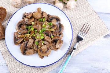 Delicious fried mushrooms on plate on table close-up