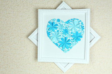 Beautiful handmade picture with heart from paper flowers on