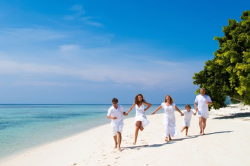 Young couple with a child and grandparents celebrating wedding