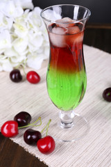Glass of cocktail on table close-up