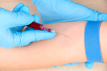 Nurse taking a blood sample, close up