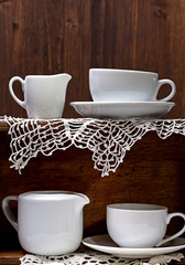 Tableware placed on a wooden shelf