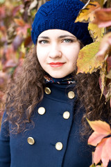 Portrait of young beautiful brunette in blue beret