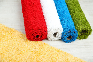 Many carpets of different colors close-up