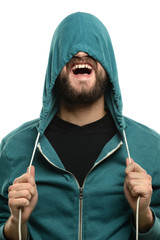 Young Man Pulling Hooded Jacket Over Head