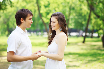 Young love Couple smiling under blue sky