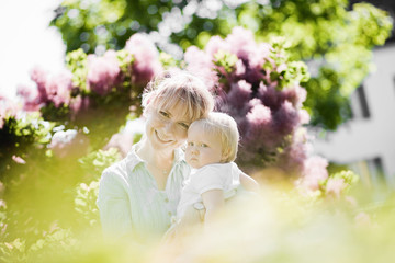 Happy mother with her little son outdoor