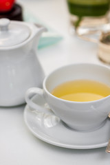 Obraz na płótnie Canvas hot tea for breakfast served in a glass cup