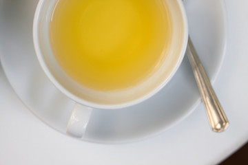 hot tea for breakfast served in a glass cup