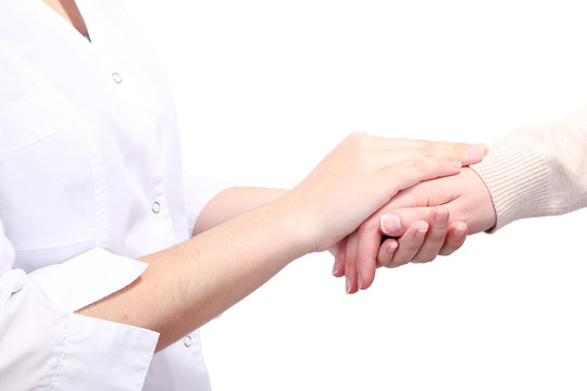 Medical doctor holding hand of patient, isolated on white