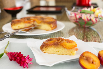 Slice of plum cake on square plate