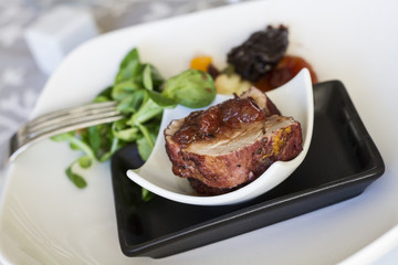 Pork tenderloin with lamb's lettuce salad, and dried apricots an