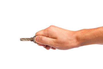 Male hand holding a key to the house
