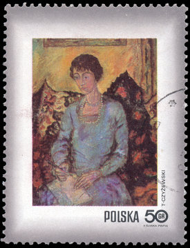 POLAND - CIRCA 1971: Woman with book, by Tytus Czyzewski, circa