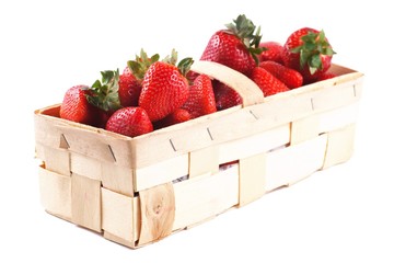 Strawberries in basket and on a white background