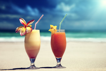 fresh fruit juices on a tropical beach