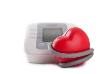 electronic blood pressure meter and red heart