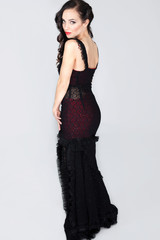 Fototapeta premium beautiful elegant woman in a black dress