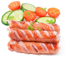 sausages on the grill and salad