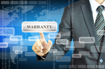 Businessman touching WARRANTY sign