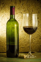 red wine and glass on a old paper background