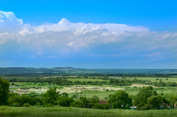 Fototapeta na wymiar Rural landscape with clouds