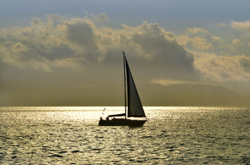 Fototapeta na wymiar Yacht in the sunset light