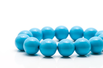 Blue necklace isolated in white background
