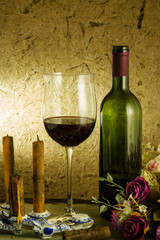 red wine and glass on a old paper background