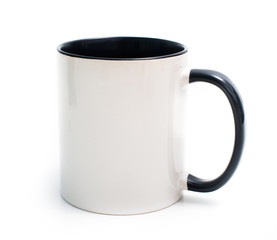 white cup with a black handle