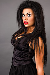 Portrait of an expressive young woman with creative makeup