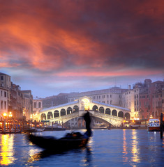 Fototapeta na wymiar Venice with gondola against Rialto bridge in Italy